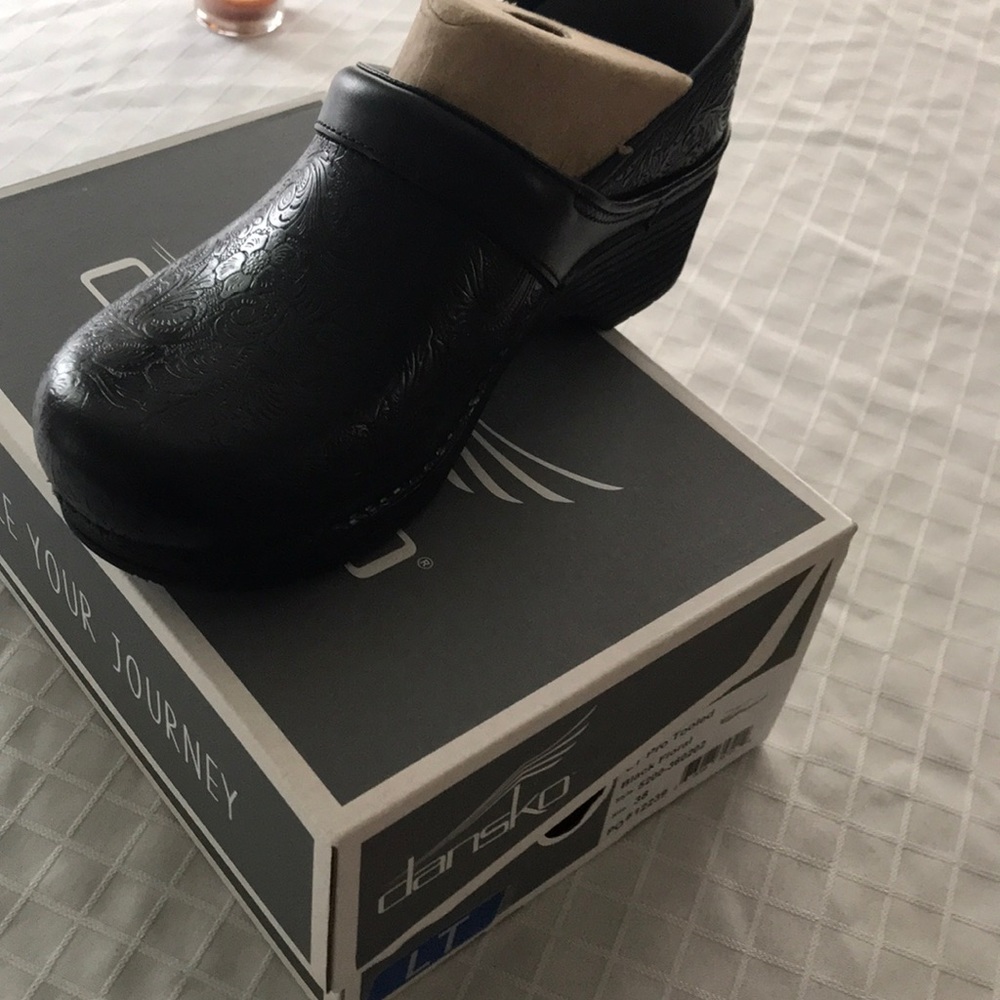 Dansko black floral clogs sized 38. Never worn.